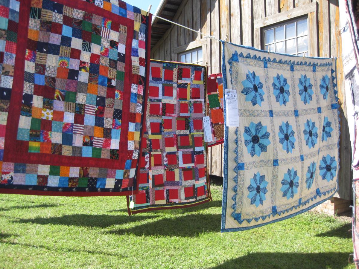 Quilts hanging outside